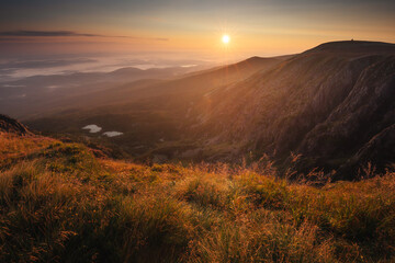 Summer views in the Karkonosze Mountains during the August sunrise. Hiking in the National Park.