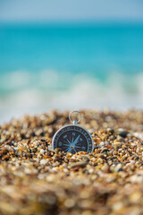 Compass on the sea beach. Selective focus. © yanadjan
