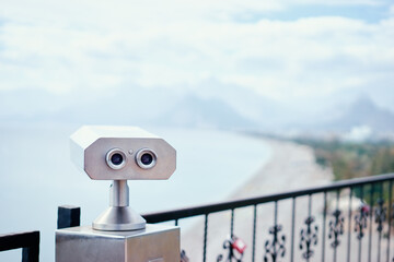 Coin Operated Binocular viewer next to the waterside promenade  looking out to the bay and city.