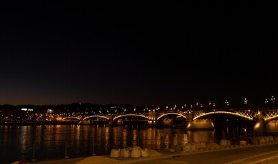 Fototapeta na wymiar Illuminated bridge over Danube in Budapest at night