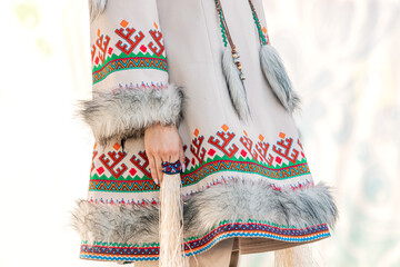 Traditional clothing of the indigenous peoples of the north. Coat richly decorated with deer fur...
