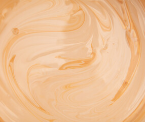 Mixing paint in beige color as abstract