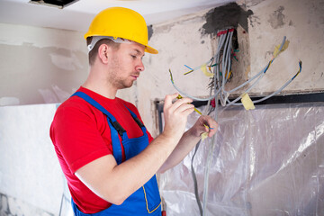 Skilled operative performing voltage checking