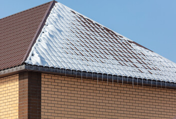 Snow on the roof of the house