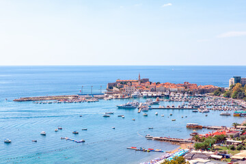 Budva beach in Montenegro . Harbor with boats at Adriatic Sea 