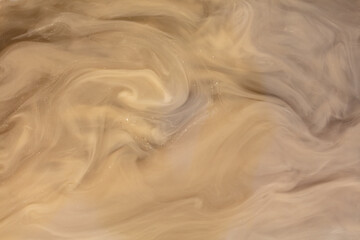 Muddy brown water in a puddle