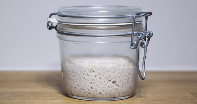 sourdough starter on kitchen table 