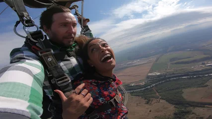 Tuinposter Sky dive selfie couple at the skies © Mauricio G