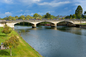 Fototapeta na wymiar River Charente and bridge at Saintes, a commune and historic town in western France, in the Charente-Maritime department of which it is a sub-prefecture, in Nouvelle-Aquitaine 