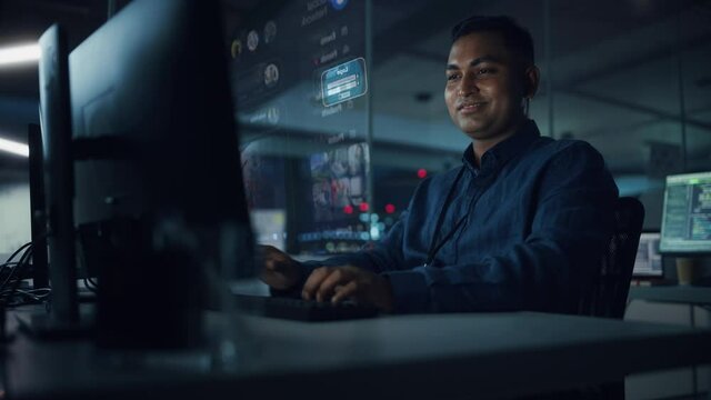 Futuristic Computer User Hologram Screens Concept: Indian Man Login, Use PC with Holographic Projection, Displays Show Websites, Video Streaming Services, Social Media, e-Commerce, e-Learning Content