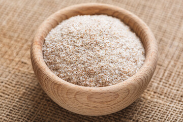 Psyllium husk in a wooden plate. Ingredient to add to food