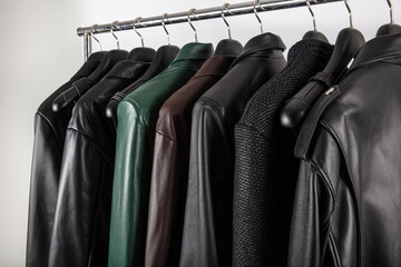 New collection of different color spring leather jackets. Leather jackets on hangers in the shop....