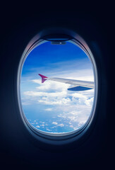 Clouds sky, looking through the window of an airplane.