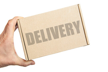 cardboard box in male hand. man holding a parcel. the inscription on the box delivery. the concept of sending parcels
