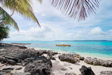 Beautiful landscape - tropical white sand beach with fishing boats. Siargao Island, Philippines.