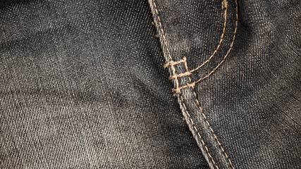Dark jeans texture. Denim cloth close up.