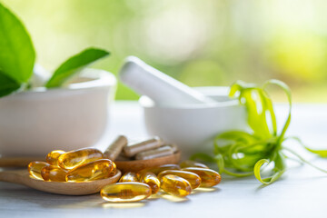 Alternative medicine herbal organic capsule with vitamin E omega 3 fish oil, mineral, drug with herbs leaf natural supplements for healthy good life.