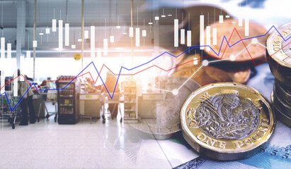 Double exposure of UK Stock graphic with credit card and new pound coin background on financial market trade chart, finance and banking concept. Mixed media. 