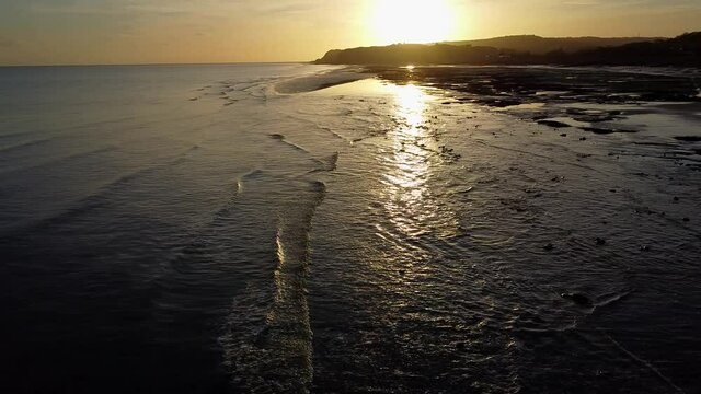 Sunset over sea and beach