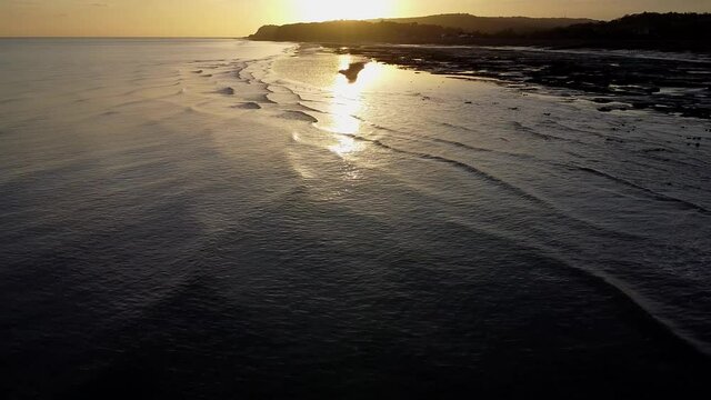 Sunset over sea and beach