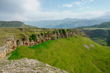 Fototapeta na wymiar Picturesque green valley and mountains in Dagestan
