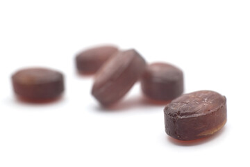 Closeup of mint and eucalyptus candies on white background