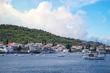 Spetses Island coast in Greece. A famous tourist destination on the Aegean sea. Old town and harbour view.