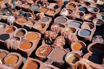 Obraz na płótnie Canvas Tanneries of Fes, Morocco, Africa Old tanks of the Fez's tanneries with color paint for leather, Morocco, Africa.