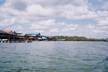 Fishing houses on stilts in mangrove lagoon, Thailand.