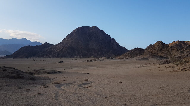 the image of the mountains on the Sinai Peninsula at sunset. the desert of Sharm el Sheikh in the evening. excursion in Egypt. travel.