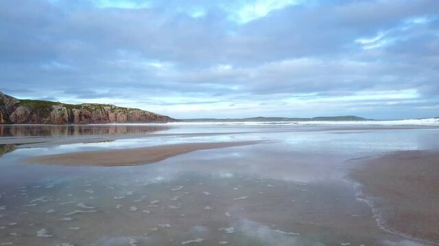 4K Beach landscape of the beach and sea, cloudy day in Scotland