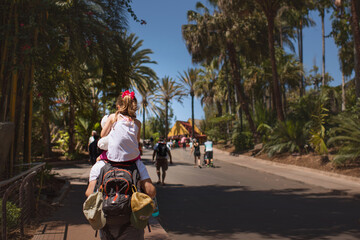 A Young Girl Daughter On her Dad Shoulders walking Exploring Family Together Sweet Loving Fun Palm Trees Love Father 