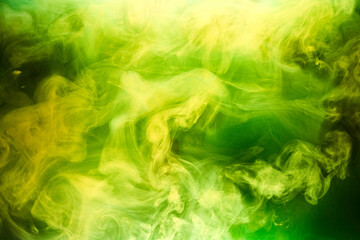 Obraz na płótnie Canvas Green smoke on black ink background, colorful fog, abstract swirling emerald ocean sea, acrylic paint pigment underwater