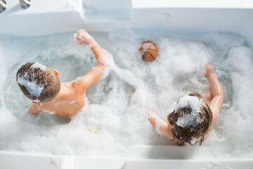 Kids Siblings Bathing in the Tub Bathtub Fun Bubbles Ball Young Family Clean Rub a Dub Dub 