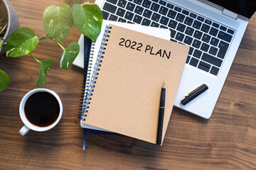 Note book with 2022 goals text on it to apply new year resolutions and plan.