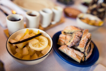Well laid table with organic homemade food and treats for sunday brunch in living room at home