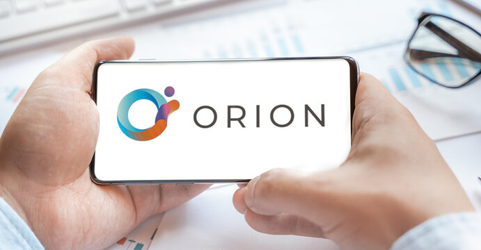 Logo of Orion Protocol in tablet. Cryptocurrency coin ORN token. Trading blockchain platform to buy,sell on decentralized exchange DEX,DEFI. Digital money.Business,investing