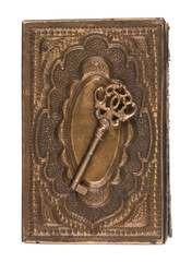 antique brass key on Bible