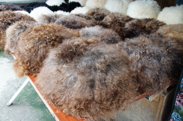 Fur hats on the market. The national headdress in the Caucasus. Fur hats. Warm hats made of natural fur.
