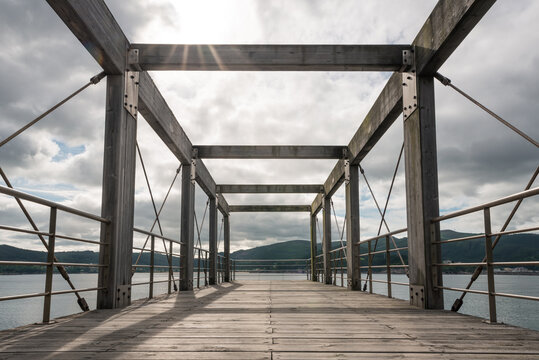 Empty wooden pier over river