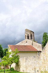 Fototapeta premium View of the Church of Saint-Jean-Baptiste in the village of Charroux, a medieval town, nestled in the heart of the Bourbonnais and classified as one of the most beautiful villages in France