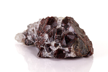 Macro stone garnet mineral on white background