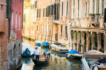 Fototapeta na wymiar Gondolier on a canal in Venice