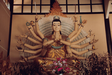 Statue of the Avalokiteshvara or Buddha with many arms inside Linh An Pagoda in Da lat, Vietnam