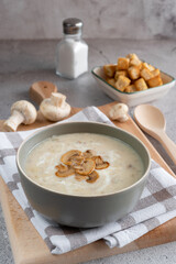 Mushroom champignon soup with fried mushroom topping.