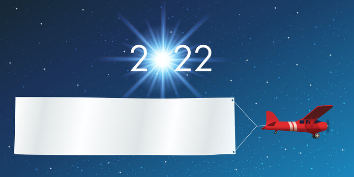 Carte de vœux 2022 montrant un avion rouge tirant une banderole blanche pour souhaiter la bonne année, devant un ciel étoilé.