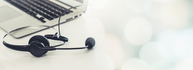 Headset and customer support equipment at call center ready for actively service . Corporate business help desk and telephone assistance concept .
