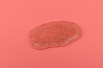 Coral transparent slime with bubbles inside on pink background. Kids toy slime.