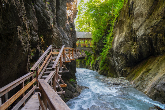 Walking through the Sigmund-Thun Klamm with wooden walkways near Kaprun in Salzburg, Austria