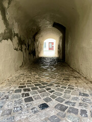 Narrow dark passage in the old town of medieval Feldkirch. Vorarlberg, Austria.